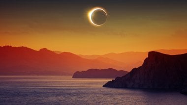 Solar eclipse in archipelago landscape Wallpaper