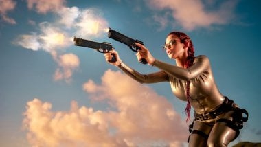 Lara Croft with pistols Wallpaper