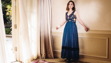 Emilia Clarke in a blue dress Wallpaper