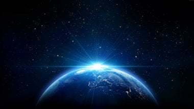 Planet Earth with flash of light Wallpaper