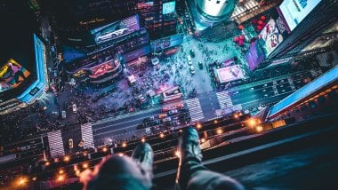 Aerial View of Times Square with man sitting Wallpaper