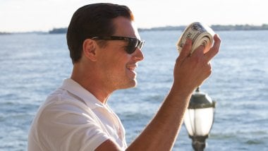 The Wolf of Wall Street with money in hand Wallpaper