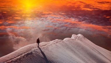 Man at the top of a mountain Wallpaper