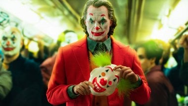Joker with clown mask Wallpaper