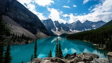 Mountains on lake at forest Wallpaper