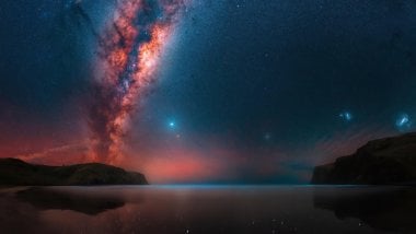 Milky way in landscape with lake and mountains Wallpaper
