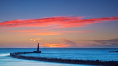 Lighthouse with sky at sunset Wallpaper