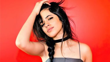 Camila Cabello with red background Wallpaper