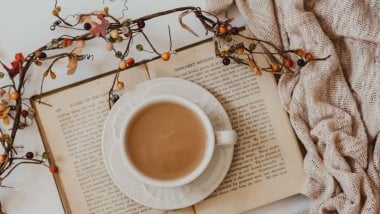 Cup of coffee and book Wallpaper