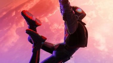 Spiderman Miles Morales hanging from spiderweb Wallpaper