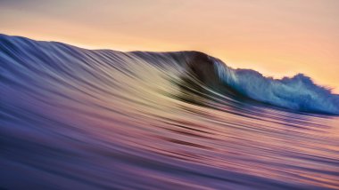 Wave reflecting sunset Wallpaper
