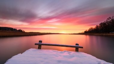 Sunrise in lake with snow Wallpaper