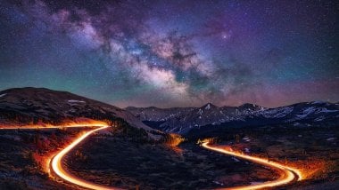 Road during starry night Wallpaper