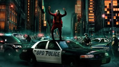 Joker dancing on top of cop car Wallpaper