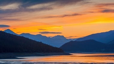 Sunset in lake next to mountains Digital Art Wallpaper