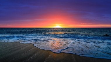 Beautiful sunset at the beach Wallpaper