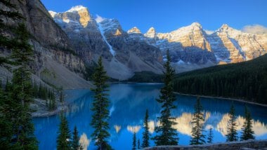 Big mountains in the forest Lake Moraine Wallpaper