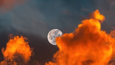 Moon behind clouds Wallpaper