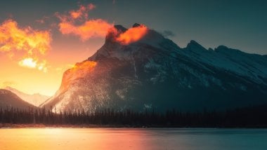 Orange sunset in the mountains Wallpaper
