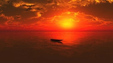 Boat in the middle of the sea at sunset Wallpaper