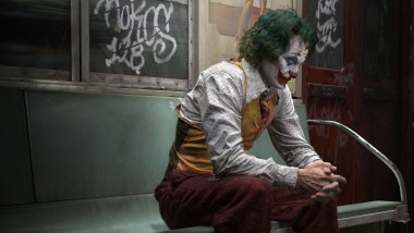 The Joker sitting on the train Wallpaper