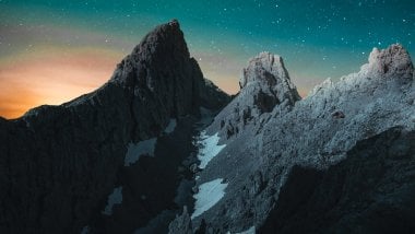 Stars in the sky in landscape with mountains Wallpaper