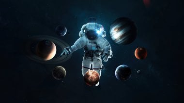 Astronauta con sistema solar Fondo de pantalla