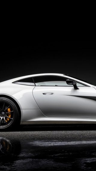 White sports car on a black background Wallpaper