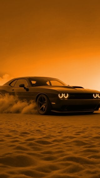 Dodge Challenger at sunset in the desert Wallpaper