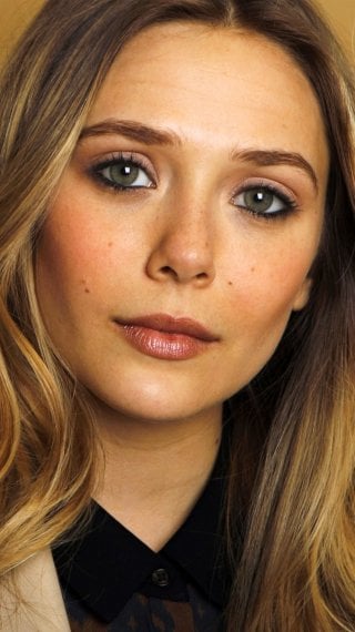 Elizabeth Olsen in a golden room Wallpaper