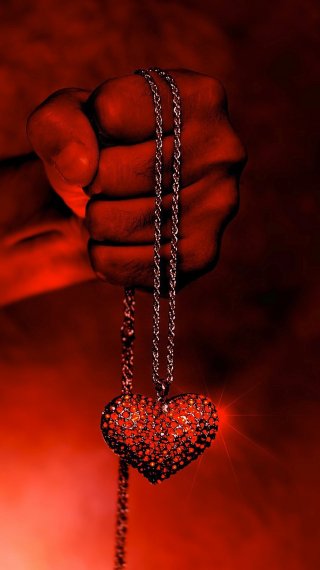 Necklace in a hand Wallpaper