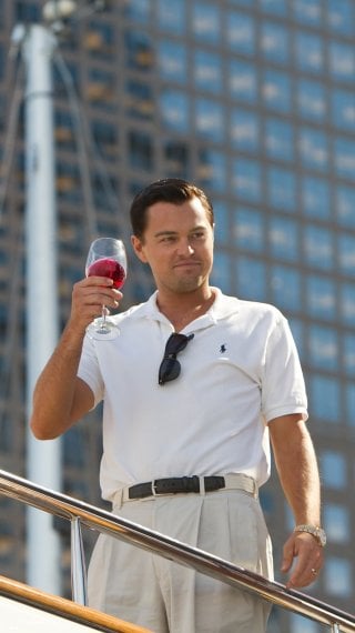 The Wolf of Wall Street with a glass of wine Wallpaper