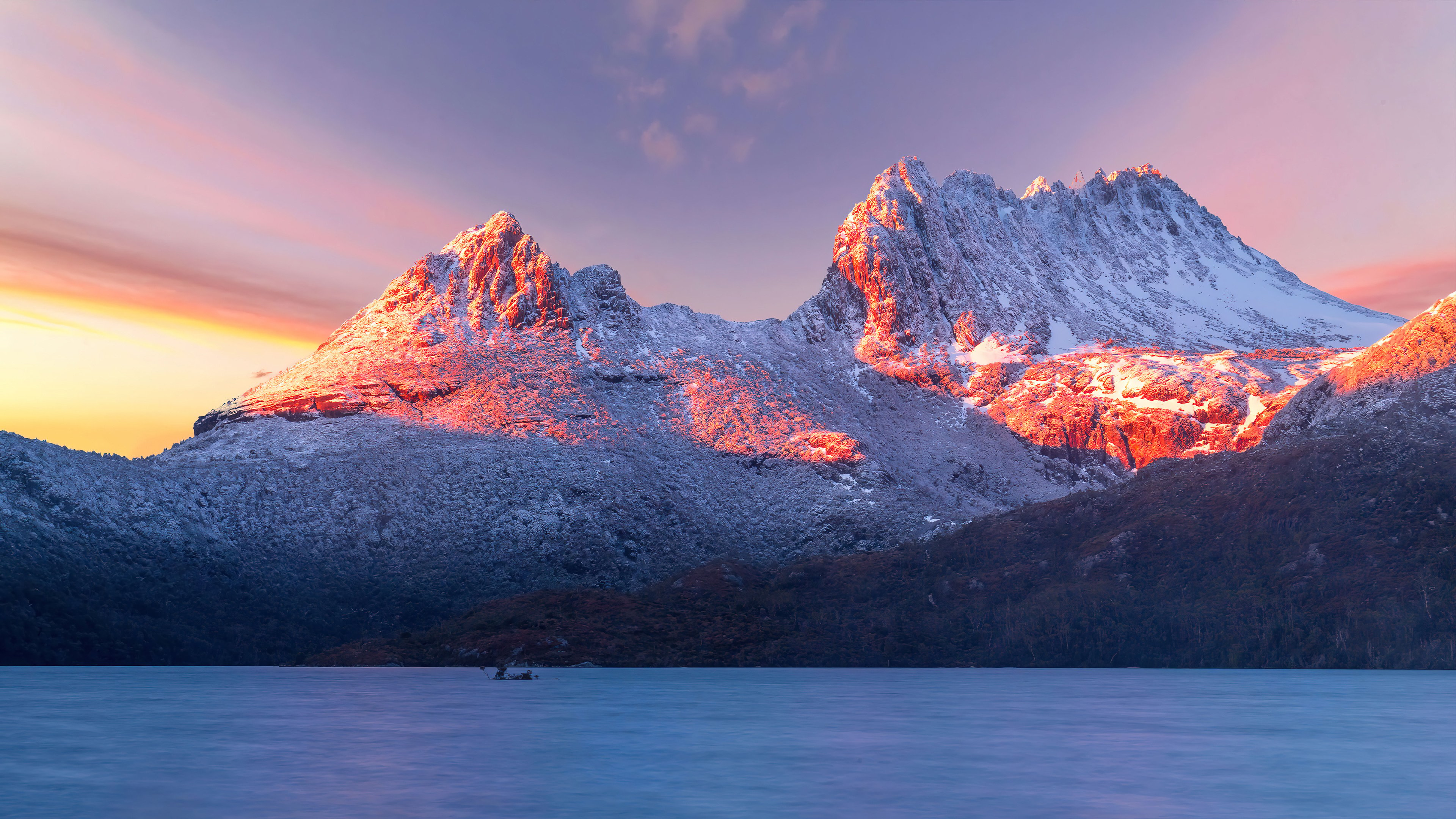 Wallpaper Sunset in snowy mountains