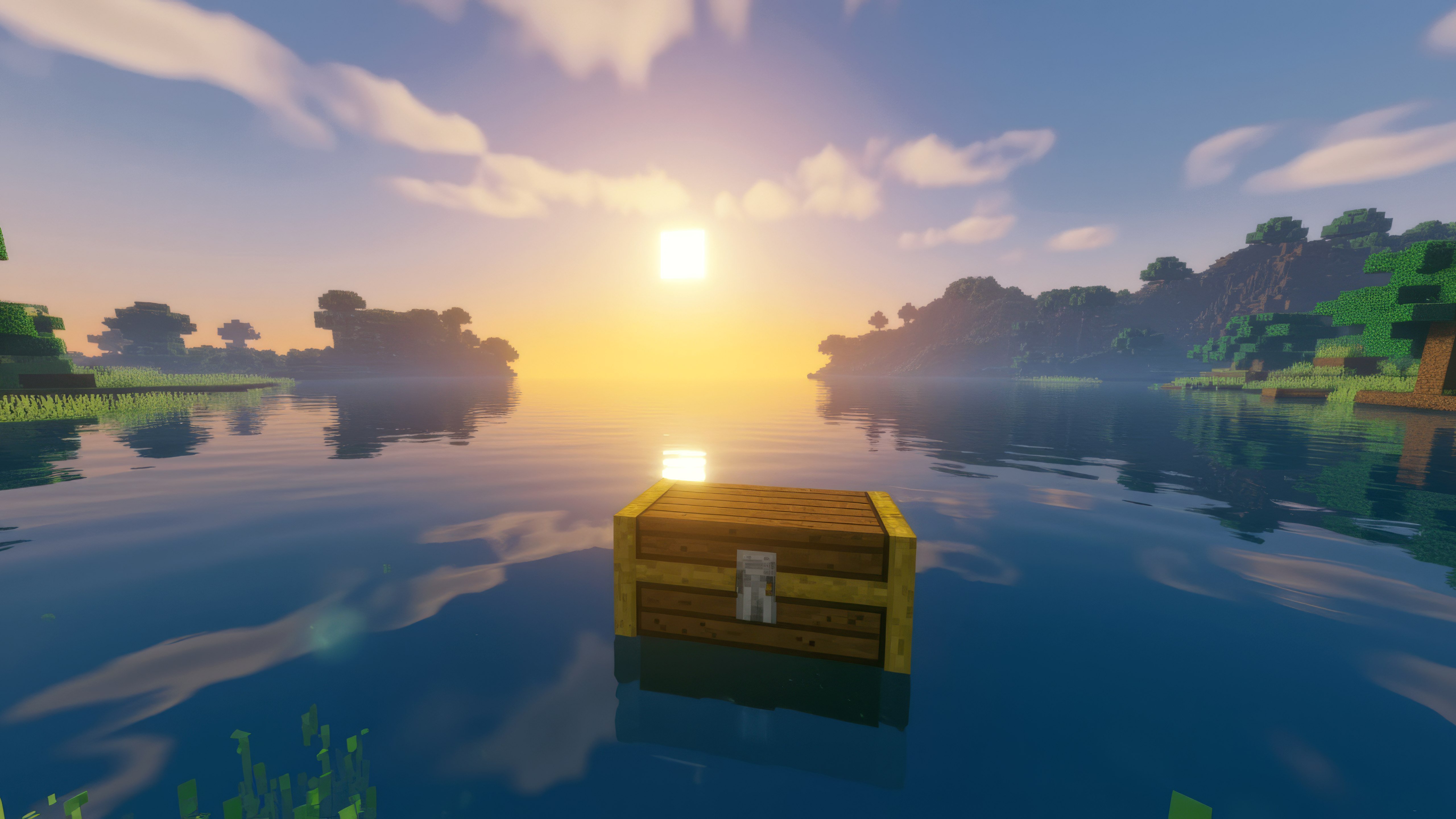 Fondos de pantalla Large Minecraft chest in a sunset lake landscape