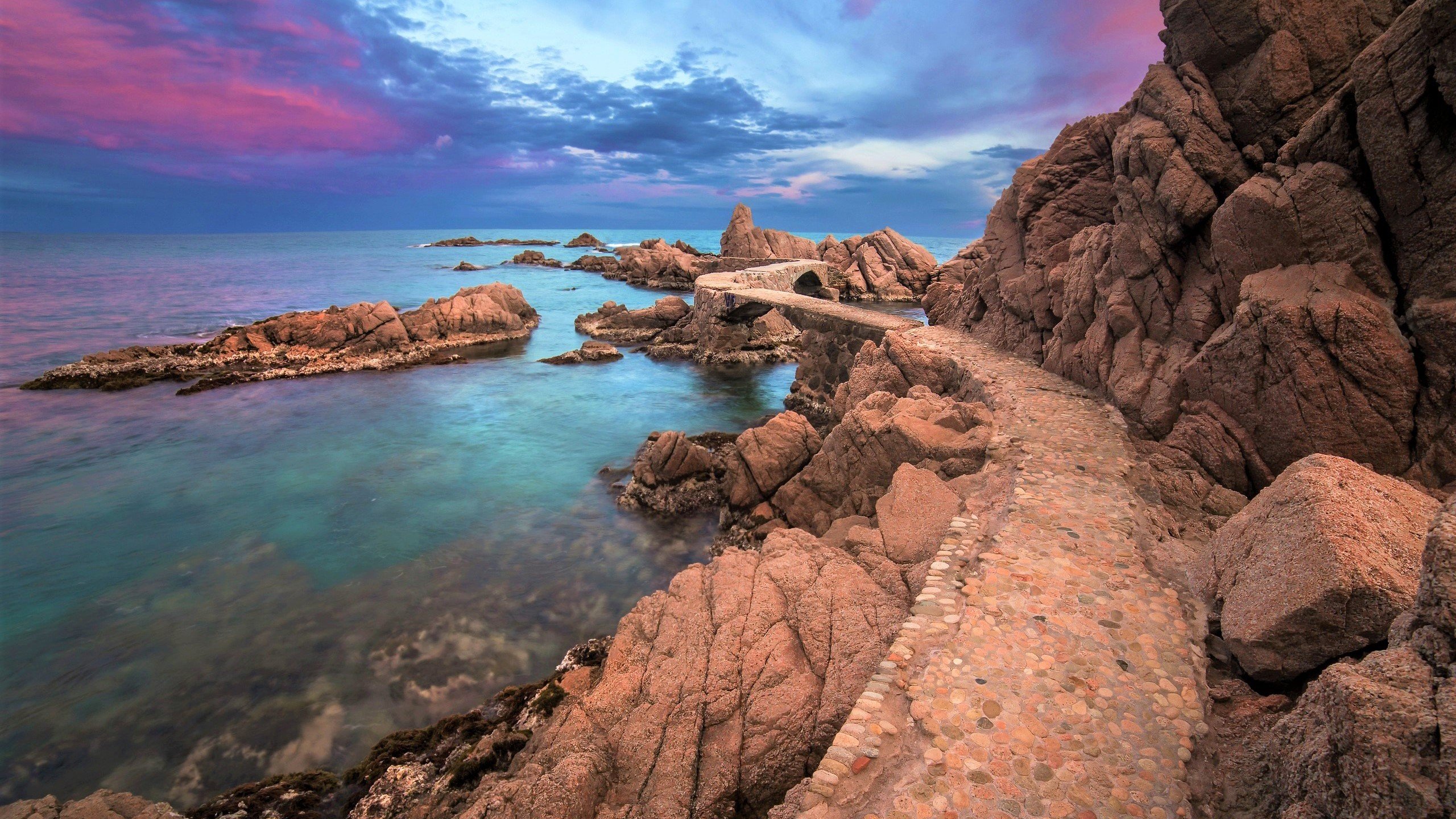 Rocks next to the ocean at sunset Wallpaper 2k Quad HD ID:10757