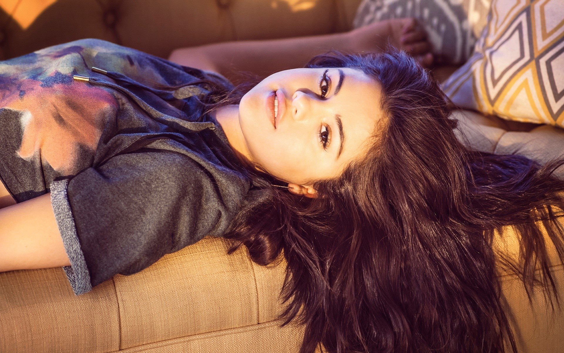 Wallpaper Selena Gomez lying in an armchair