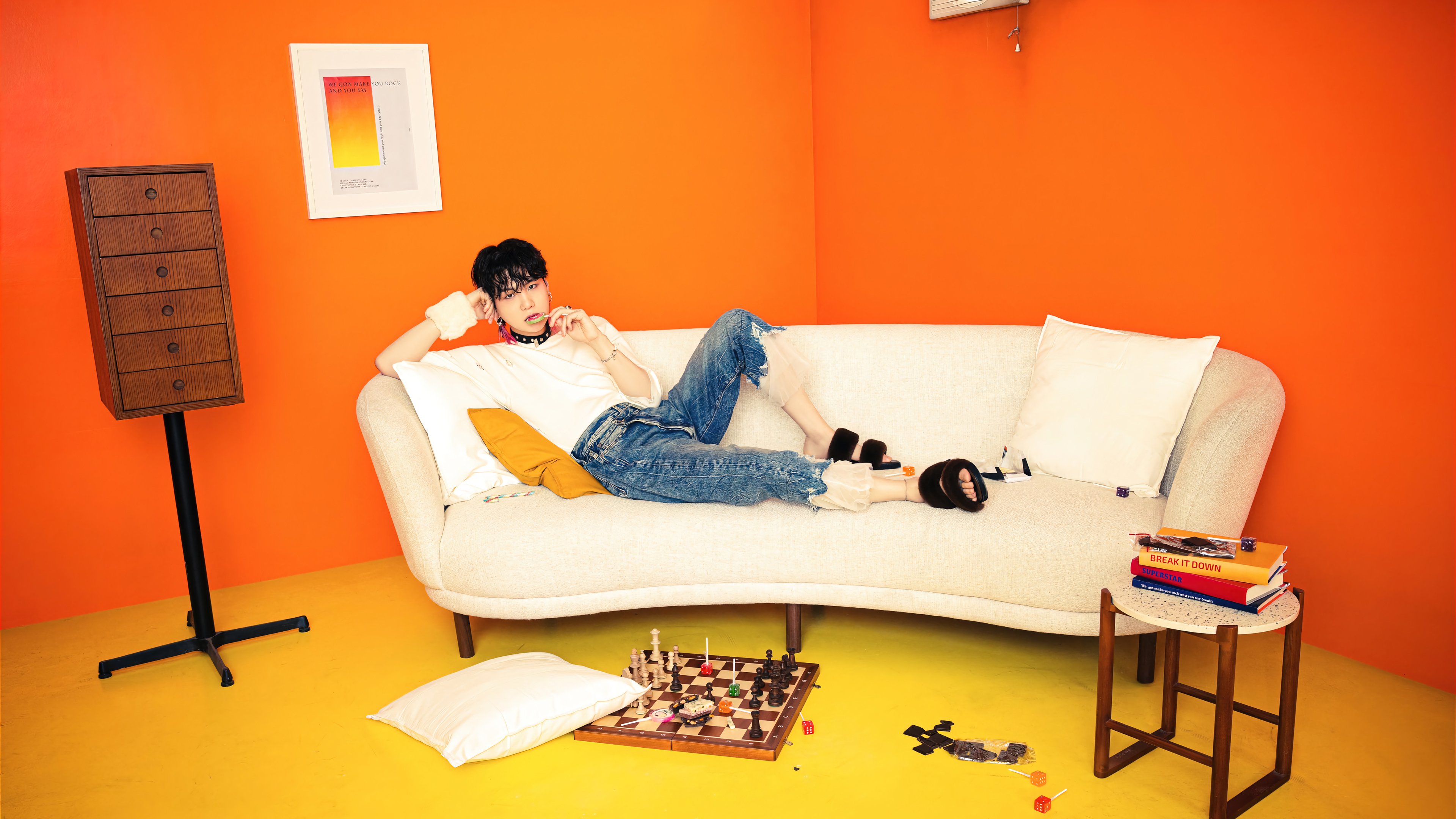 Wallpaper Suga from BTS laying down on couch