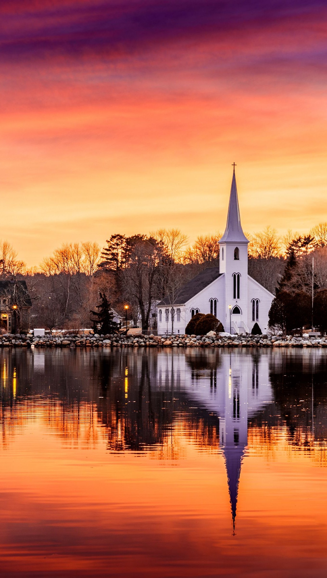 Wallpaper Chapel in front of river at sunset Vertical