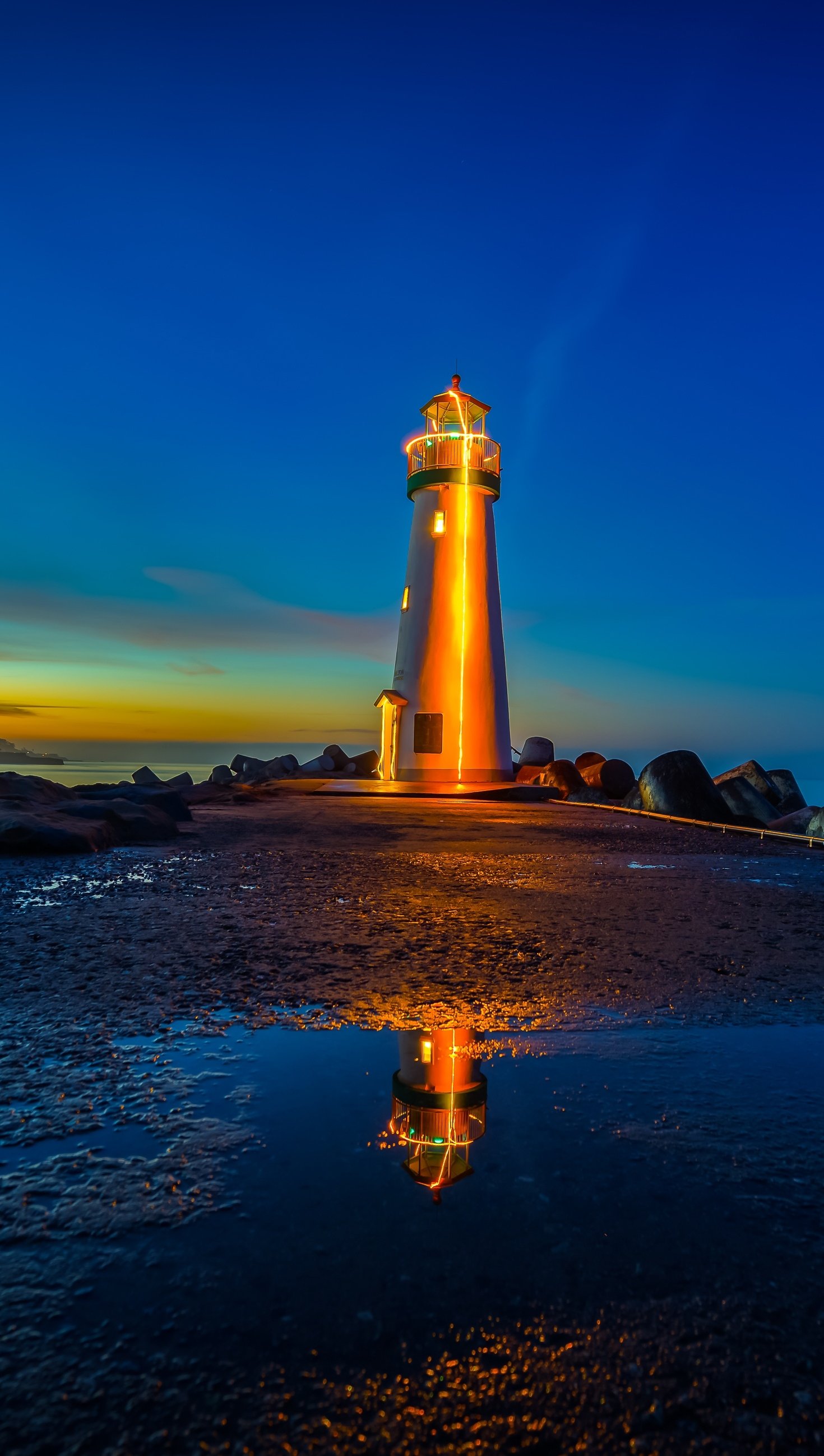 Wallpaper Lighthouse in beach at sunset Vertical