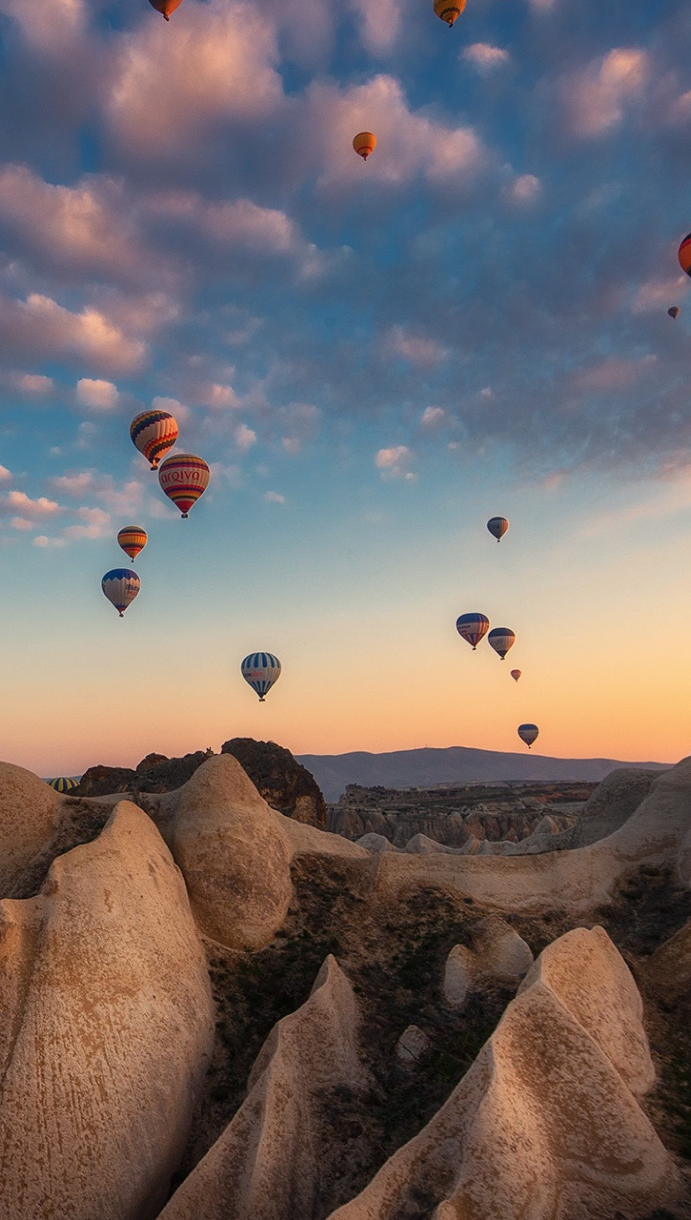 Wallpaper Hot Air Balloons in mountains at sunset Vertical