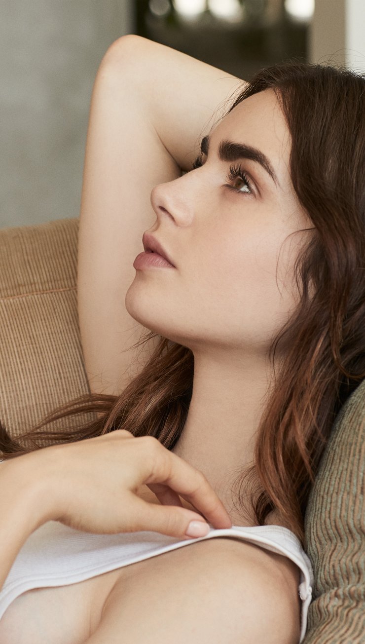 Wallpaper Lily Collins laying down Vertical