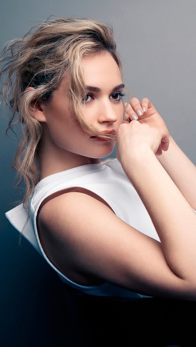 Wallpaper Lily James in a chair Vertical